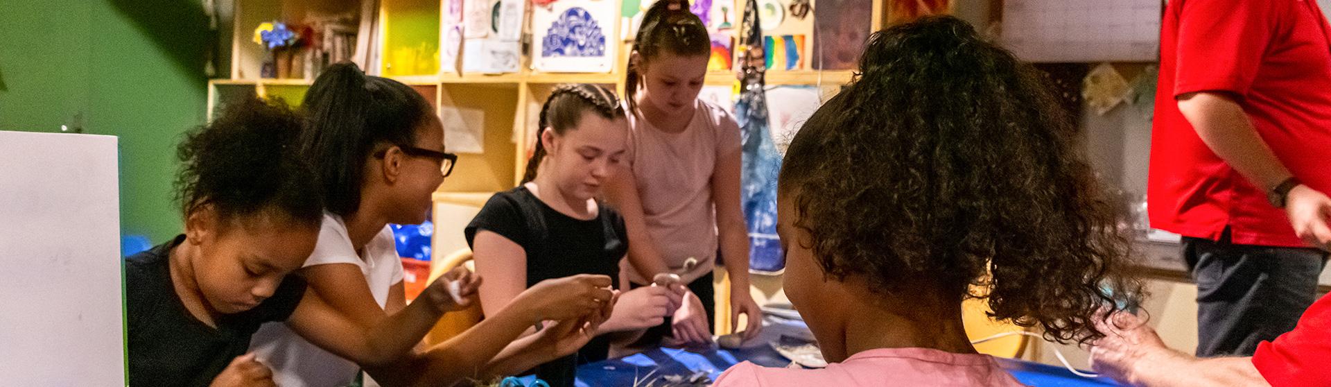 image of children creating artwork and crafts in KidSPACE